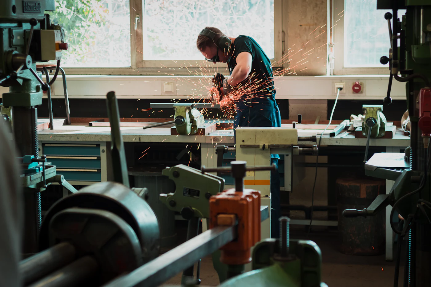 Worker at a machine in a workshop
